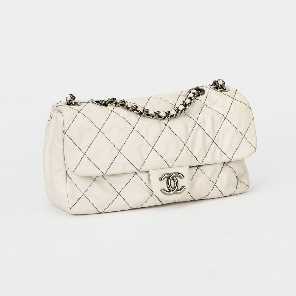 Chanel Flap Bag Off‑White Lambskin Contrast Black Stitching Ruthenium‑Tone Hardware